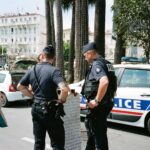 two police men standing